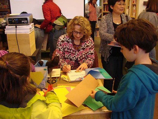 signing books and a craft activity